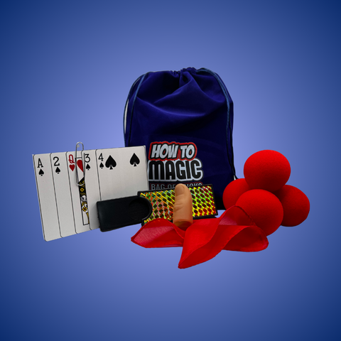 Mini Bag of Tricks magic kit with sponge balls, coin slide tray, clipped card trick, thumb tip, silk, and velvet bag